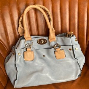 Super cute blue bag. Still has lots of life left. Comes with shoulder strap